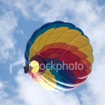 ist2_2032250-hot-air-balloon-amidst-clouds